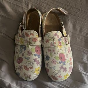 Worn only ones floral pattern, white slip on.